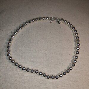 RLL: Silver tone beaded necklace.